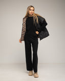 Chaleco acolchado oversize reversible con capucha y bolsillos de cremallera. - Tantra Spain