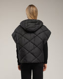Chaleco acolchado oversize reversible con capucha y bolsillos de cremallera. - Tantra Spain