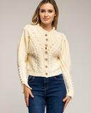 Chaqueta de punto de crochet con detalles de pompones y flores. (ECRU) - Tantra Spain