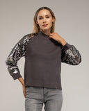 Jersey de punto con mangas de lentejuelas. - Tantra Spain