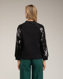 Jersey de punto con mangas de lentejuelas. - Tantra Spain