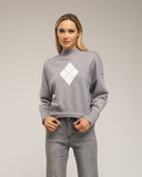 Jersey de punto con rombo y detalles de strass y cuello perkins - Tantra Spain