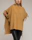 Poncho de punto con flecos en los laterales, cuello perkins y bolsillos. - Tantra Spain