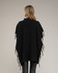Poncho de punto con flecos en los laterales, cuello perkins y bolsillos. - Tantra Spain