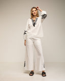 Set de pantalon y top con bordados en las mangas, cuello y en el bajo del pantalon - Tantra Spain