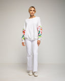 Sudadera con bordados en las mangas. - Tantra Spain