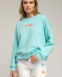 Sudadera con texto iconic en fluor en la parte delantera y trasera (TURQUESA) - Tantra Spain