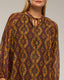 Vestido con estampado geométrico, vuelo en el bajo y cierre de lazada. - Tantra Spain